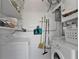 Laundry room with washer, dryer, and shelving at 407 Dunn Ne Dr, Port Charlotte, FL 33952