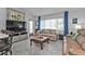 Living room with light colored floors and couches at 407 Dunn Ne Dr, Port Charlotte, FL 33952