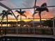 Sunset view from the screened pool area at 407 Dunn Ne Dr, Port Charlotte, FL 33952