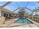 Refreshing pool with screened enclosure and canal views at 407 Dunn Ne Dr, Port Charlotte, FL 33952