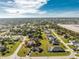 Aerial view showing single-Gathering home and surrounding neighborhood at 42 Santarem Cir, Punta Gorda, FL 33983