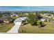 Single-Gathering home with driveway, landscaping, and neighborhood view at 42 Santarem Cir, Punta Gorda, FL 33983