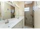 Bright bathroom features double sinks and a separate shower at 42 Santarem Cir, Punta Gorda, FL 33983