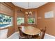 Bright dining area with wood table and chairs at 42 Santarem Cir, Punta Gorda, FL 33983