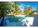 Relaxing pool area with lush landscaping at 42 Santarem Cir, Punta Gorda, FL 33983