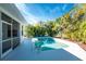 Private pool and patio with tropical plants at 42 Santarem Cir, Punta Gorda, FL 33983