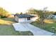 House with driveway and yard, seen from above at 4200 Kilpatrick St, Port Charlotte, FL 33948