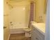 Clean bathroom with tub, toilet and vanity at 4200 Kilpatrick St, Port Charlotte, FL 33948