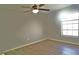 Bright bedroom featuring wood-look floors and ceiling fan at 4200 Kilpatrick St, Port Charlotte, FL 33948