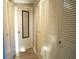 Linen closet with louvered doors and mirrored door at 4200 Kilpatrick St, Port Charlotte, FL 33948