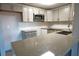 Modern kitchen with gray cabinets and granite countertops at 4200 Kilpatrick St, Port Charlotte, FL 33948