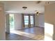 Living room with hardwood floors, gray walls, and ceiling fan at 4200 Kilpatrick St, Port Charlotte, FL 33948