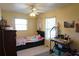 Cozy bedroom with twin bed and built-in shelving at 422 Omen St, Punta Gorda, FL 33982