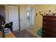 Spacious bedroom with double closet and view of dining area at 422 Omen St, Punta Gorda, FL 33982