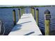 White composite dock with wooden posts and a dedicated area at 422 Omen St, Punta Gorda, FL 33982