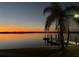 Tranquil waterfront scene featuring a dock at sunset, offering picturesque views at 422 Omen St, Punta Gorda, FL 33982