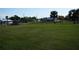 Vacant lot with grassy field and distant view of houses, offering development potential at 422 Omen St, Punta Gorda, FL 33982