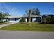 Ranch-style home with a carport and yard at 422 Omen St, Punta Gorda, FL 33982