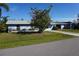 Light blue house with a spacious yard at 422 Omen St, Punta Gorda, FL 33982