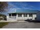 Side view of house with ramp access at 422 Omen St, Punta Gorda, FL 33982