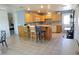 Bright kitchen with wood cabinets, and an island with seating at 422 Omen St, Punta Gorda, FL 33982