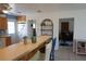 Kitchen with island, wood cabinets and view into living room at 422 Omen St, Punta Gorda, FL 33982