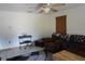 Living room with brown armchairs and a keyboard at 422 Omen St, Punta Gorda, FL 33982