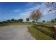 Peaceful park with grassy areas, wooden fence, and a gravel path at 422 Omen St, Punta Gorda, FL 33982