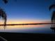 Stunning sunset over calm water, creating a serene and picturesque waterfront view at 422 Omen St, Punta Gorda, FL 33982