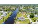 Aerial view showcasing waterfront home and landscape at 4630 Fallon Cir, Port Charlotte, FL 33948