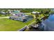 Aerial view of canal-front home with pool and private dock at 4630 Fallon Cir, Port Charlotte, FL 33948