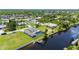 Aerial view of waterfront home with pool and private dock at 4630 Fallon Cir, Port Charlotte, FL 33948