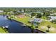 Waterfront home with pool and private dock; aerial view at 4630 Fallon Cir, Port Charlotte, FL 33948