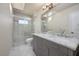 Modern bathroom with double vanity and walk-in shower at 4630 Fallon Cir, Port Charlotte, FL 33948