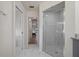 Bathroom with large walk-in shower and view of bedroom at 4630 Fallon Cir, Port Charlotte, FL 33948