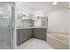 Elegant bathroom with double vanity and corner soaking tub at 4630 Fallon Cir, Port Charlotte, FL 33948