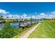 Private dock on a peaceful canal with lush vegetation at 4630 Fallon Cir, Port Charlotte, FL 33948