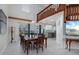 Formal dining room showcasing a large wooden table and access to the backyard at 4630 Fallon Cir, Port Charlotte, FL 33948