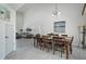 Bright dining room with a wooden table and access to the living room at 4630 Fallon Cir, Port Charlotte, FL 33948