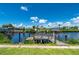 Wooden dock on calm canal, neighborhood view at 4630 Fallon Cir, Port Charlotte, FL 33948