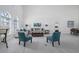 Open concept living room with high ceilings, hardwood floors, and comfortable seating at 4630 Fallon Cir, Port Charlotte, FL 33948