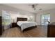 Spacious main bedroom with large window and sliding door access at 4630 Fallon Cir, Port Charlotte, FL 33948