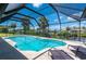 Enclosed pool and patio area with water view at 4630 Fallon Cir, Port Charlotte, FL 33948