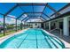 Enclosed rectangular pool with canal view at 4630 Fallon Cir, Port Charlotte, FL 33948