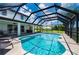 Enclosed pool with canal view and lounge chair at 4630 Fallon Cir, Port Charlotte, FL 33948