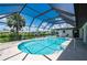 Enclosed pool area with canal view and lounge chairs at 4630 Fallon Cir, Port Charlotte, FL 33948