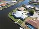 Aerial view of a waterfront home with a metal roof at 490 Sorrento Ct, Punta Gorda, FL 33950