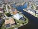 An aerial view of a waterfront home with a pool at 490 Sorrento Ct, Punta Gorda, FL 33950