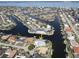 Aerial view of waterfront home with private dock and pool at 490 Sorrento Ct, Punta Gorda, FL 33950