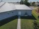 Aerial view of house backyard with paved pathway at 490 Sorrento Ct, Punta Gorda, FL 33950